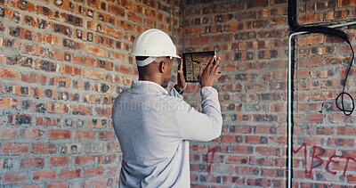 Buy stock photo Photography, architect and man with tablet in building, property inspection and infrastructure review. Back, site evaluation and person with tech for renovation plan, space or electrical line picture