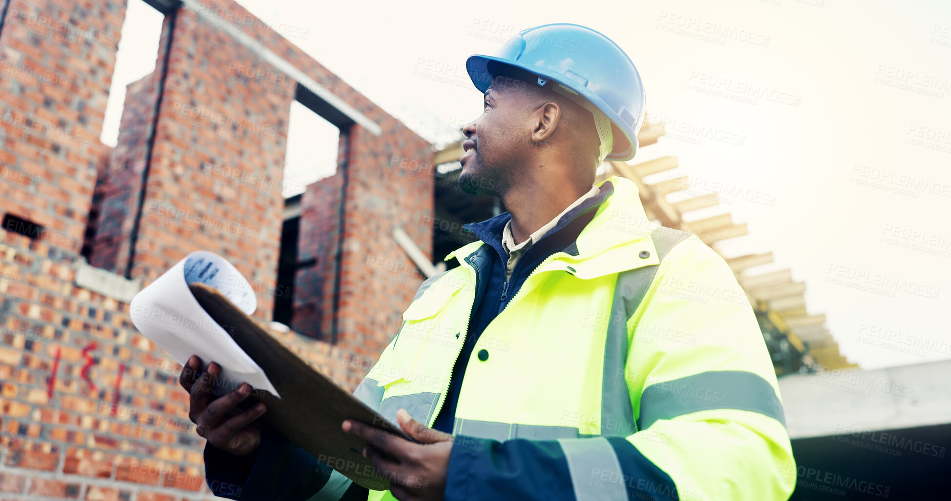 Buy stock photo Architect, clipboard and black man on construction site for building inspection, safety or security. Male person, contractor or civil engineer with smile or checklist for project infrastructure