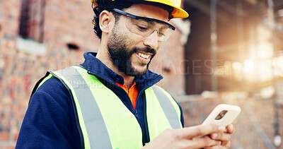 Buy stock photo Architect, phone and happy man on construction site for communication, network or connection. Male person, contractor or civil engineer typing with smile on smartphone for online texting or chatting