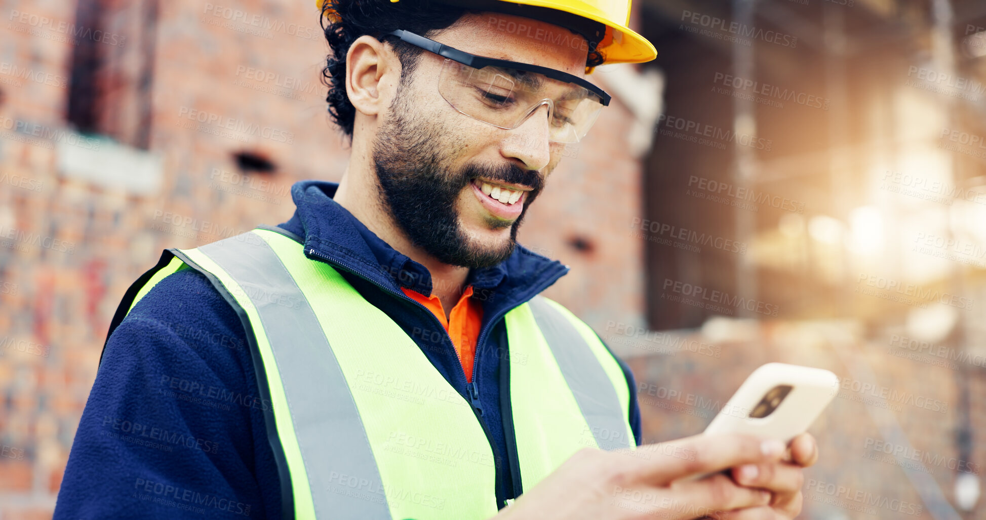 Buy stock photo Architect, phone and happy man on construction site for communication, network or connection. Male person, contractor or civil engineer typing with smile on smartphone for online texting or chatting