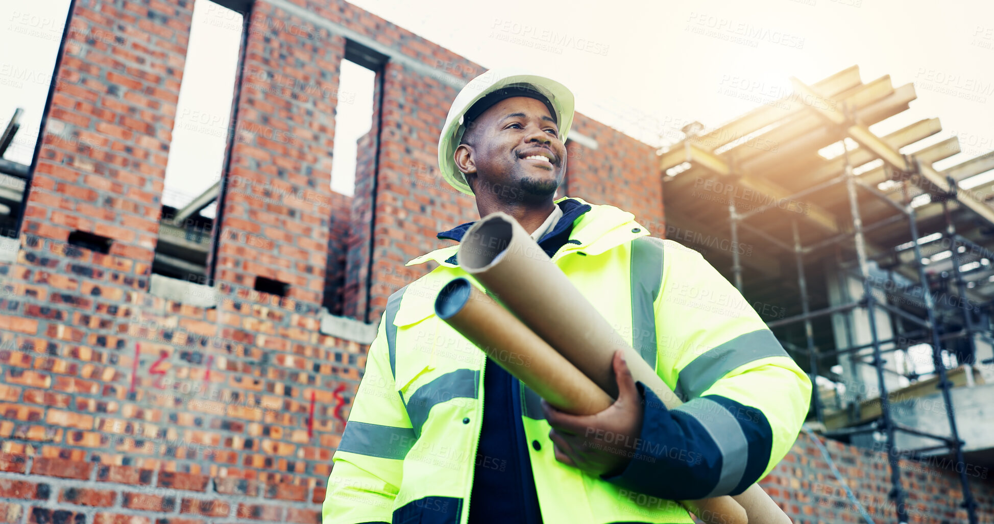 Buy stock photo Construction, thinking or black man outdoor with blueprint, progress reflection or mindset in building evaluation. Smile, low angle or engineer with ppe, project perspective or operation plan on site