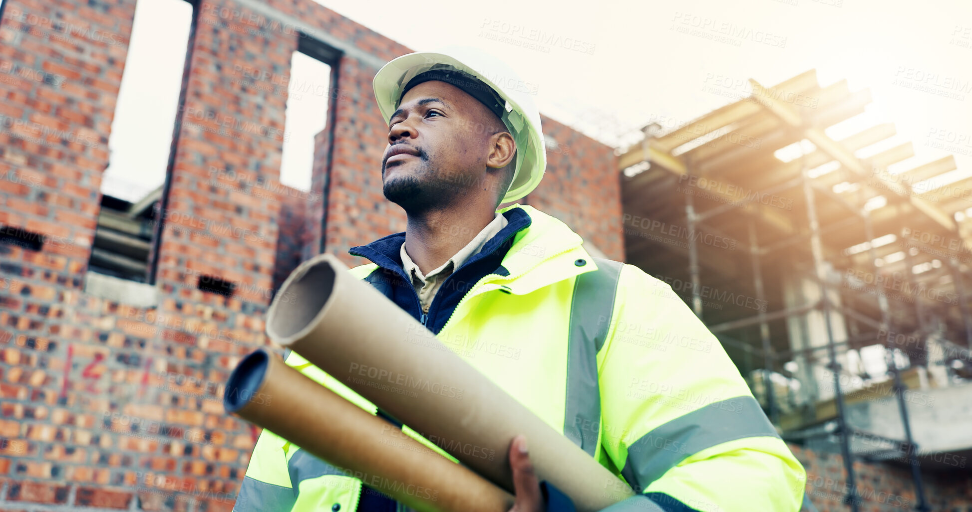 Buy stock photo Construction, thinking or black man outdoor with blueprint, operation plan or mindset in building review. Documents, low angle or engineer with ppe, project insight or progress reflection on site.