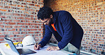 Engineer, writing and man with blueprint for construction, design and layout for renovation. Male person, tech or document with drawing for architecture, building expansion and floor plan for project