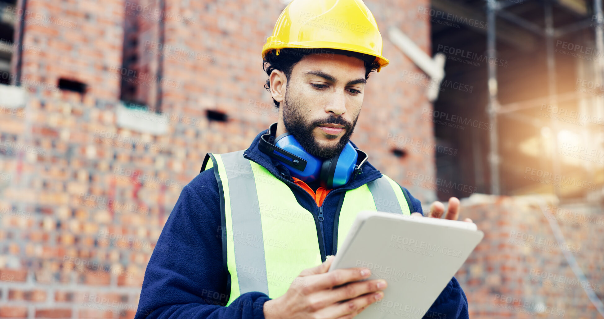 Buy stock photo Construction site, engineering and man with internet, tablet for online schedule and renovation. Person, architecture and employee with urban development, connection and tech for building plan