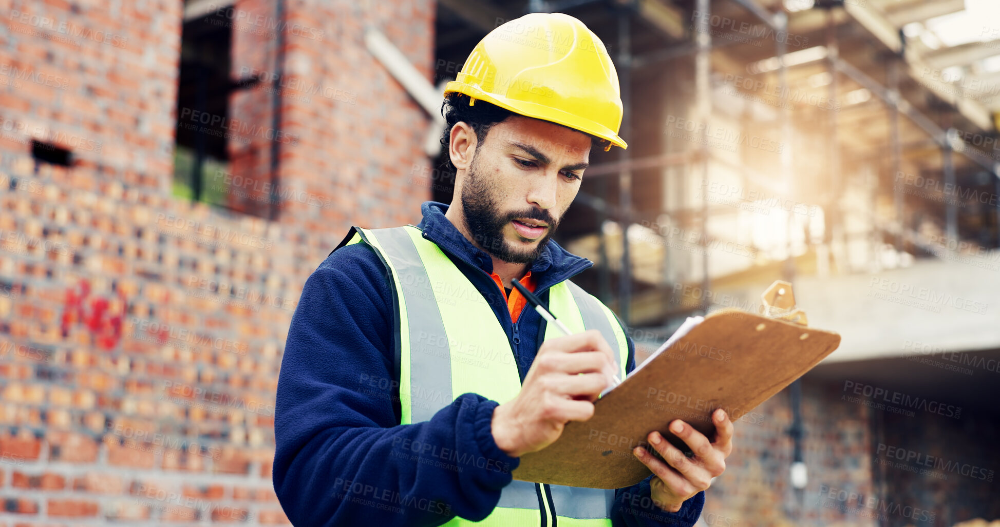 Buy stock photo Man, architect and writing with clipboard on construction site for building inspection or security. Male person, contractor or civil engineer with checklist, notes or hard hat for architecture safety