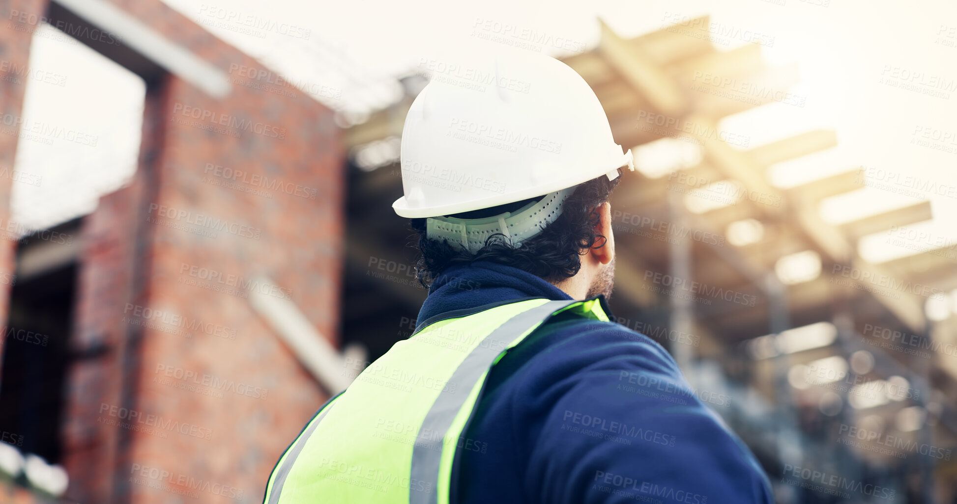 Buy stock photo Construction, thinking or man outdoor with inspection, progress reflection or mindset in building review. Industrial, low angle or engineer with back, project assessment or operation insight on site.