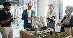 Property development, meeting and team in office with model, feedback or discussion in design review. Building, people or architects with prototype, structure plan or group evaluation on investment.