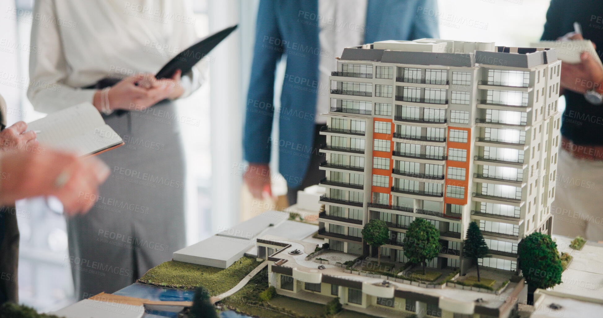 Buy stock photo Property development, meeting and hands in office with model, feedback or discussion in design review. Building, people or architect with prototype, structure plan or team evaluation on investment.