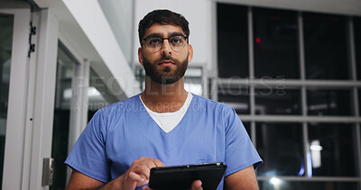 Buy stock photo Night, tablet and thinking with nurse man in hospital for healthcare, medical review or study. App, help and research with thoughtful person in dark clinic for internship or residency as student