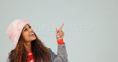 Buy stock photo Pointing, studio and woman by mockup space for offer, news or announcement for advertising. Happy, promotion and person with presentation gesture for information with marketing by gray background.