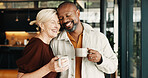 Happy, couple and relax in home with coffee, love and partner affection for weekend break. Smile, interracial mature people and laugh at house with drinks, admiration and romance for bonding together