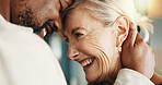 Interracial couple, forehead touch and smile for love, reunion and commitment for relationship. Happy, mature people and security with embrace, romance and space with bonding and partner in home