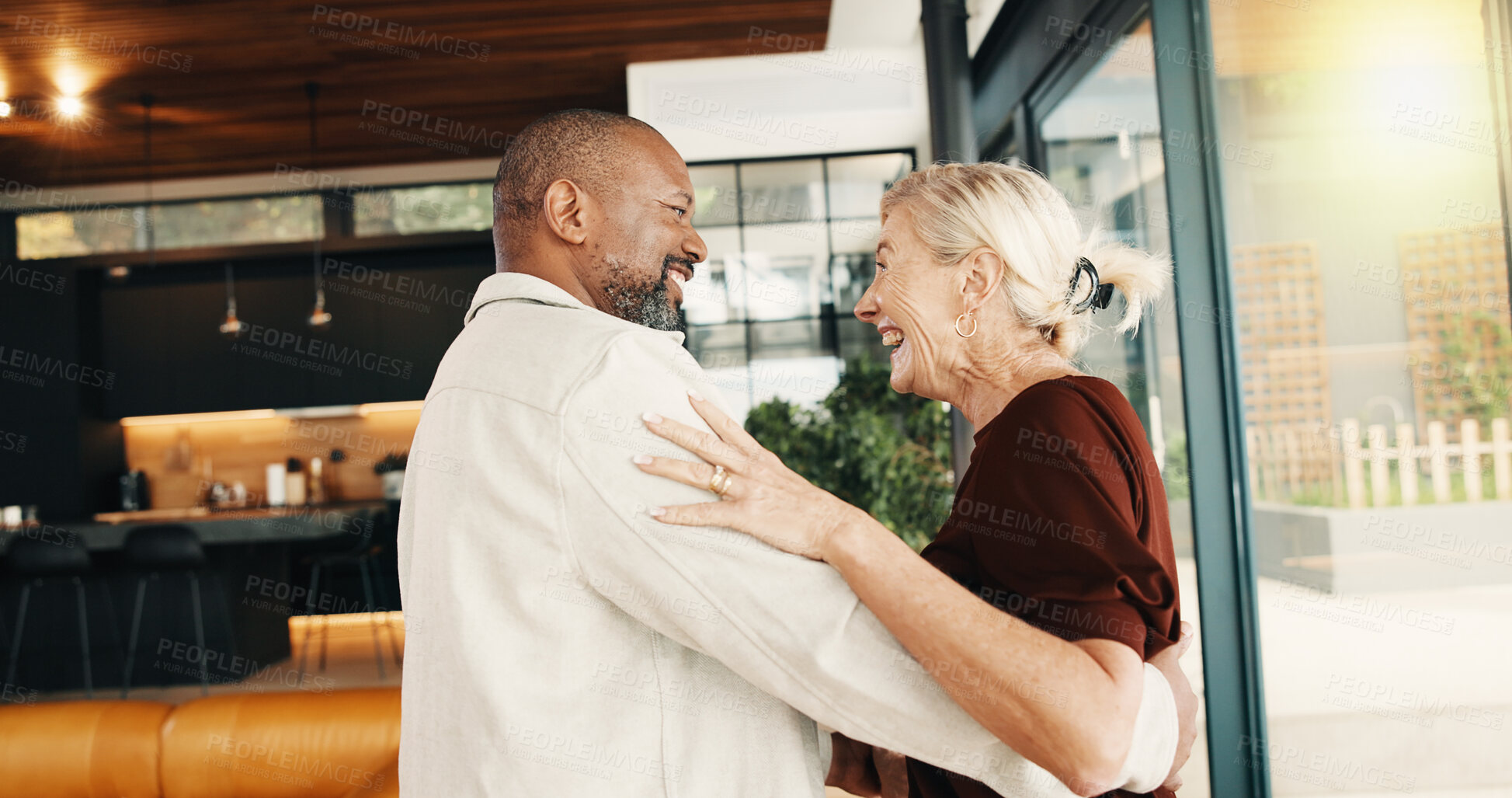 Buy stock photo Interracial couple, dance and man with smile, love and reunion or commitment for relationship. Happy, mature people and security with embrace, romance and space with bonding and partner in home