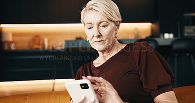 Buy stock photo Serious, woman and texting with phone in home, online and communication with contact on social media. Typing, message and mature person with mobile, internet connection and reading chat on website 