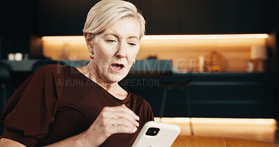 Buy stock photo Surprised, woman and texting with phone, home and communication with contact or news on social media. Reading, gossip and mature person with mobile in living room, shocked and networking on website