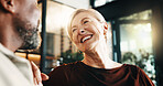 Smile, woman and relax in home with man, love and partner affection for weekend break in lounge. Happy, interracial mature couple and laughing at house with admiration, romance and bonding together