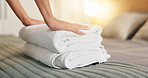 Hands, towel and woman making bed in hotel for daily routine, fresh fabric or maintenance. Change, cleaning and tidy with person in bedroom of accommodation for chores, housework or responsibility