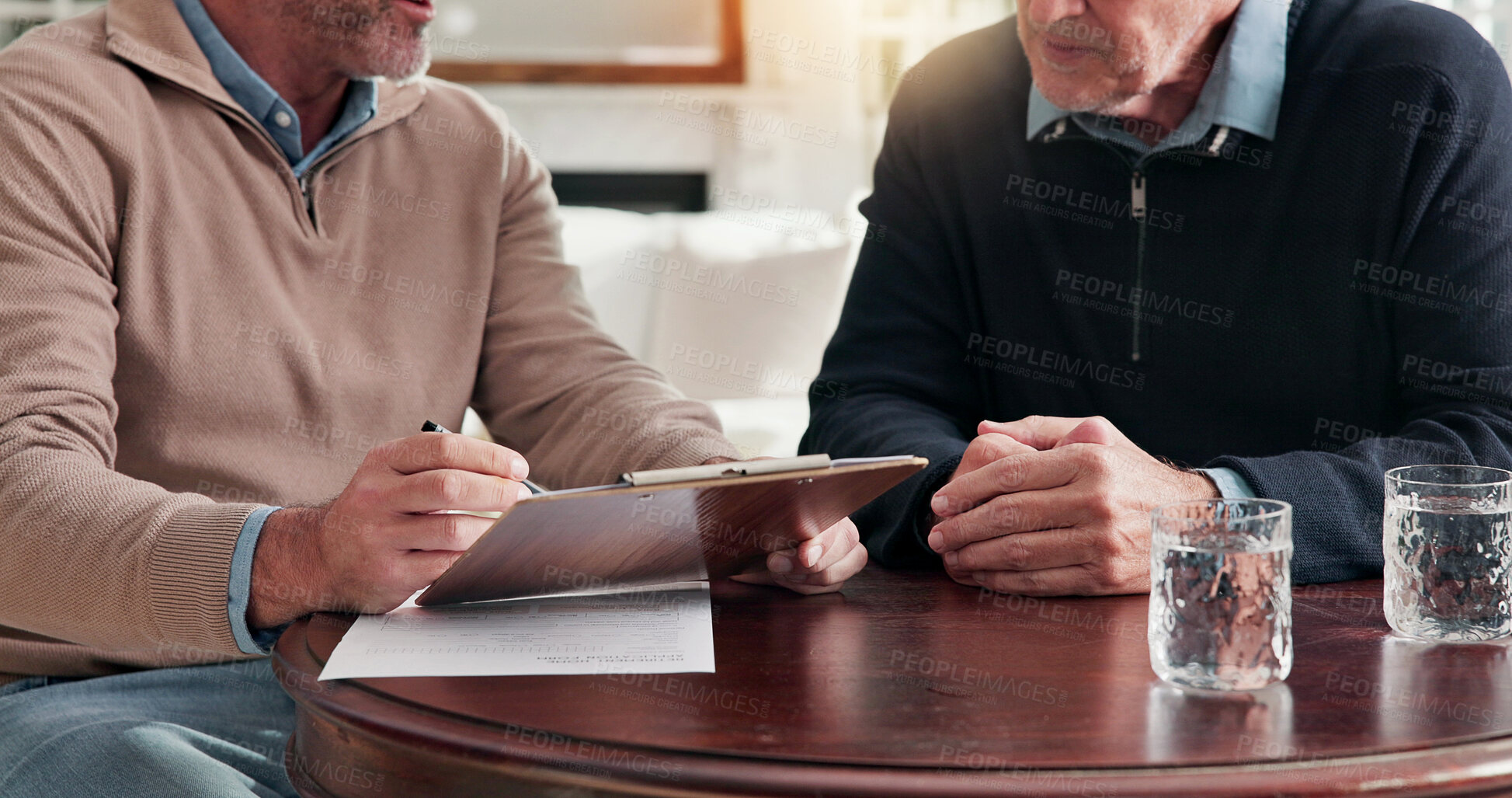 Buy stock photo Clipboard, discussion and hands of business men in home for finance agreement, consent form or paperwork. Documents, conversation and financial manager with client for investment contract in house.