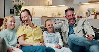 Buy stock photo Parents, children and watching tv in home with laugh, family time or bonding together for funny cartoon. Happy people, father and mother relax on sofa with girl kids, comedy show and streaming movie.