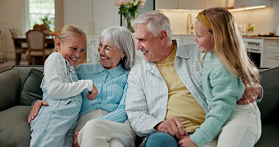 Buy stock photo Love, grandparents or girls in home with hug, childcare or bonding together on weekend break. Smile, senior people or grandkids with embrace, happy moment or family connection in caring relationship.