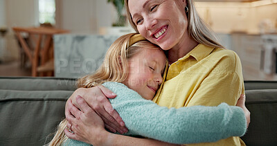 Buy stock photo Hug, happy and mother with kid on sofa in home for bonding, love and trust on weekend together. Smile, connection and mom embracing girl child in living room for relax, safety and family in apartment