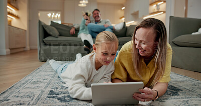Buy stock photo Mother, child and play in home with tablet, family bonding together and online gaming for education. Happy, woman ad daughter relax in lounge with tech, entertainment or parent help for learning game