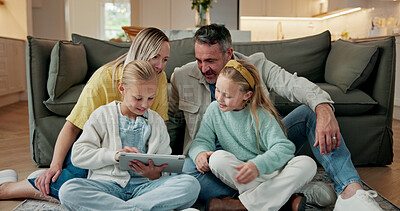 Buy stock photo Parents, children and play in home with tablet, bonding together and learning game for development. Happy people, mother and father in house with girl kids, tech and educational gaming for knowledge.