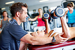 Giving her expert advice during her workout