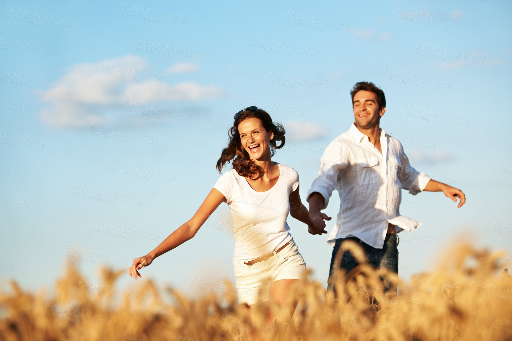 Buy stock photo Holding hands, running and laugh with couple in field for honeymoon getaway, support and trust. Care, connection and date with man and woman in countryside for loyalty, holiday and travel together