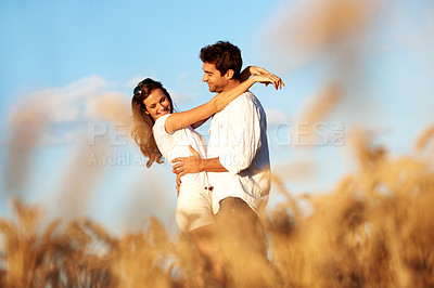 Buy stock photo Smile, hug and love with couple in field for spring date, honeymoon getaway and bonding. Trust, holiday and connection with man and woman in countryside for romance, travel vacation and care