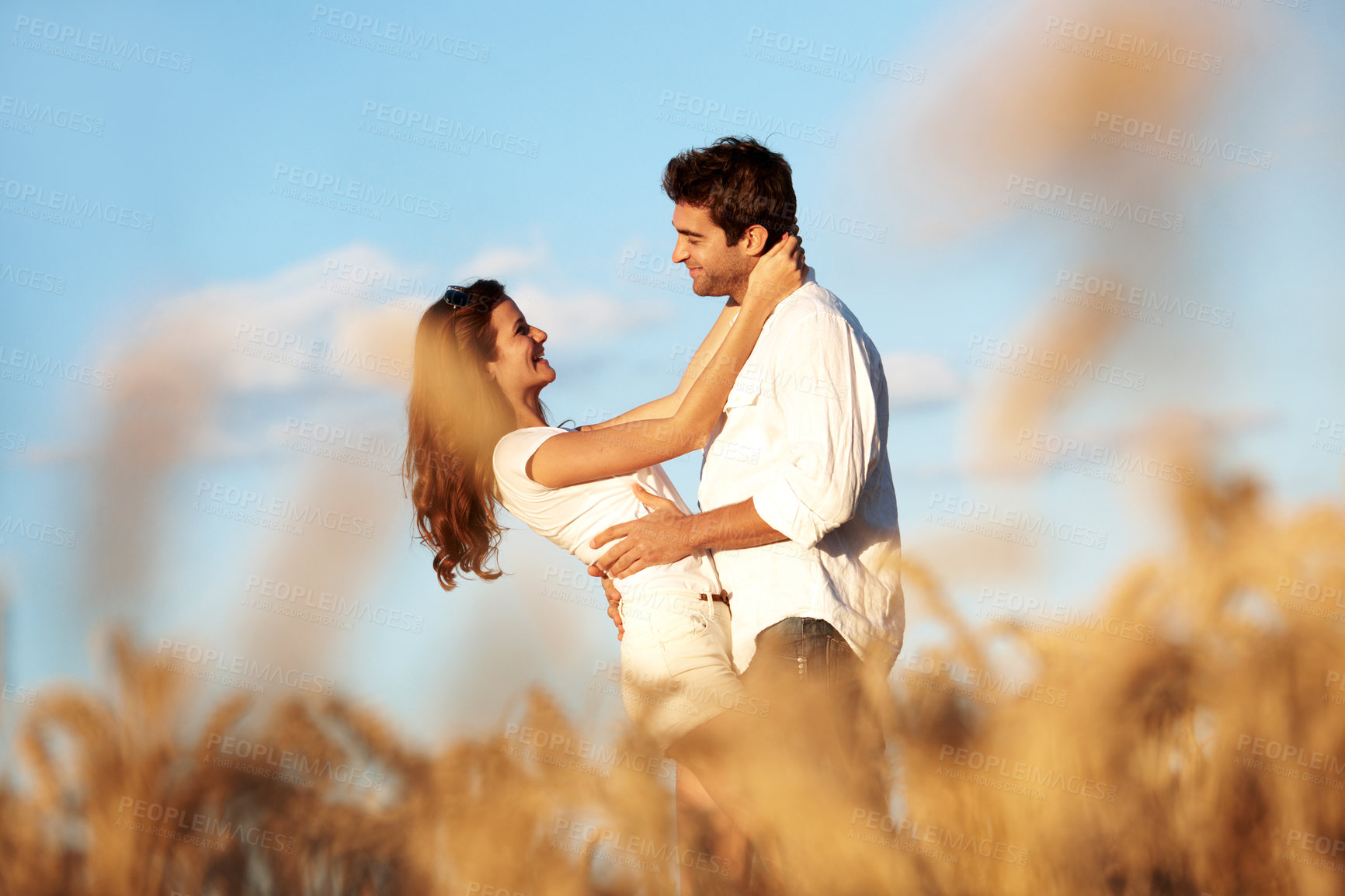 Buy stock photo Care, hug and love with couple in field for spring date, honeymoon getaway and bonding. Trust, holiday and connection with man and woman in countryside for romance, travel vacation and smile