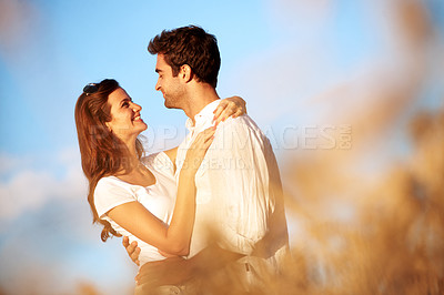 Buy stock photo Love, happy couple and hug at field for connection, healthy relationship and support on vacation. Smile, woman and man embrace in countryside with partner for trust, care and romance on holiday