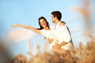 Buy stock photo Love, freedom and carry with couple in field for connection, bonding and spring date together. Support, happiness and marriage anniversary with man and woman in countryside for care and getaway