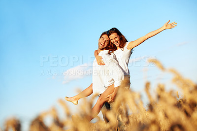 Buy stock photo Couple, portrait and piggyback in nature, sky and excited with partner on weekend, love and together. Outdoor space, freedom and happy people on summer vacation, connection and low angle on adventure