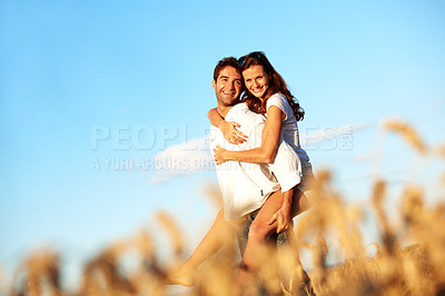 Buy stock photo Piggyback, love and portrait with couple in field for honeymoon getaway, support and trust. Care, connection and date with man and woman in countryside for loyalty, holiday and travel space