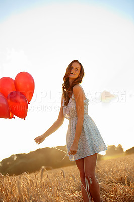 Buy stock photo Celebration, woman or happy with balloons in wheat field for birthday getaway, sunshine or space. Travel, girl and smile with countryside party for personal milestone, weekend trip and special event