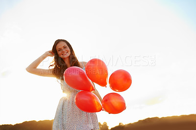 Buy stock photo Balloons, girl and portrait with sunset for freedom, vacation or happiness for travel fun. Smile, woman and excited outdoor for weekend trip with holiday, space and celebration for adventure