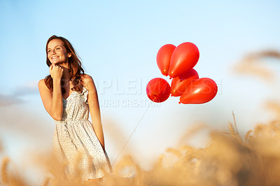 Buy stock photo Fun, thinking or woman in nature with balloons, trip celebration or mindfulness on summer break. Smile, low angle or person outdoor with enjoyment, special moment or holiday mindset in field.