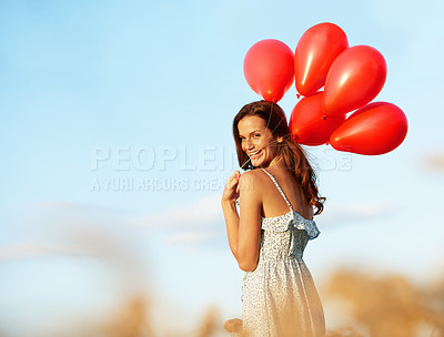 Buy stock photo Portrait, balloons and happy woman in nature for outdoor romance, love or valentines day. Female person, smile and travel with inflatables for romantic surprise or anniversary on space in countryside