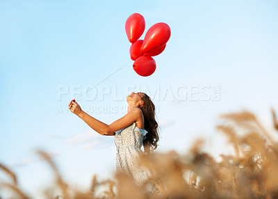 Buy stock photo Fun, thinking or woman in countryside with balloons, trip celebration or mindfulness on summer break. Happy, low angle or person in nature with space, special moment or enjoyment with holiday mindset