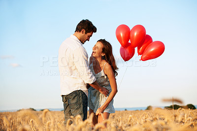 Buy stock photo Balloons, laugh and couple in nature with bonding, celebration or anniversary vacation. Happy, blue sky and man with woman outdoor with decoration on date for love in marriage on holiday together.