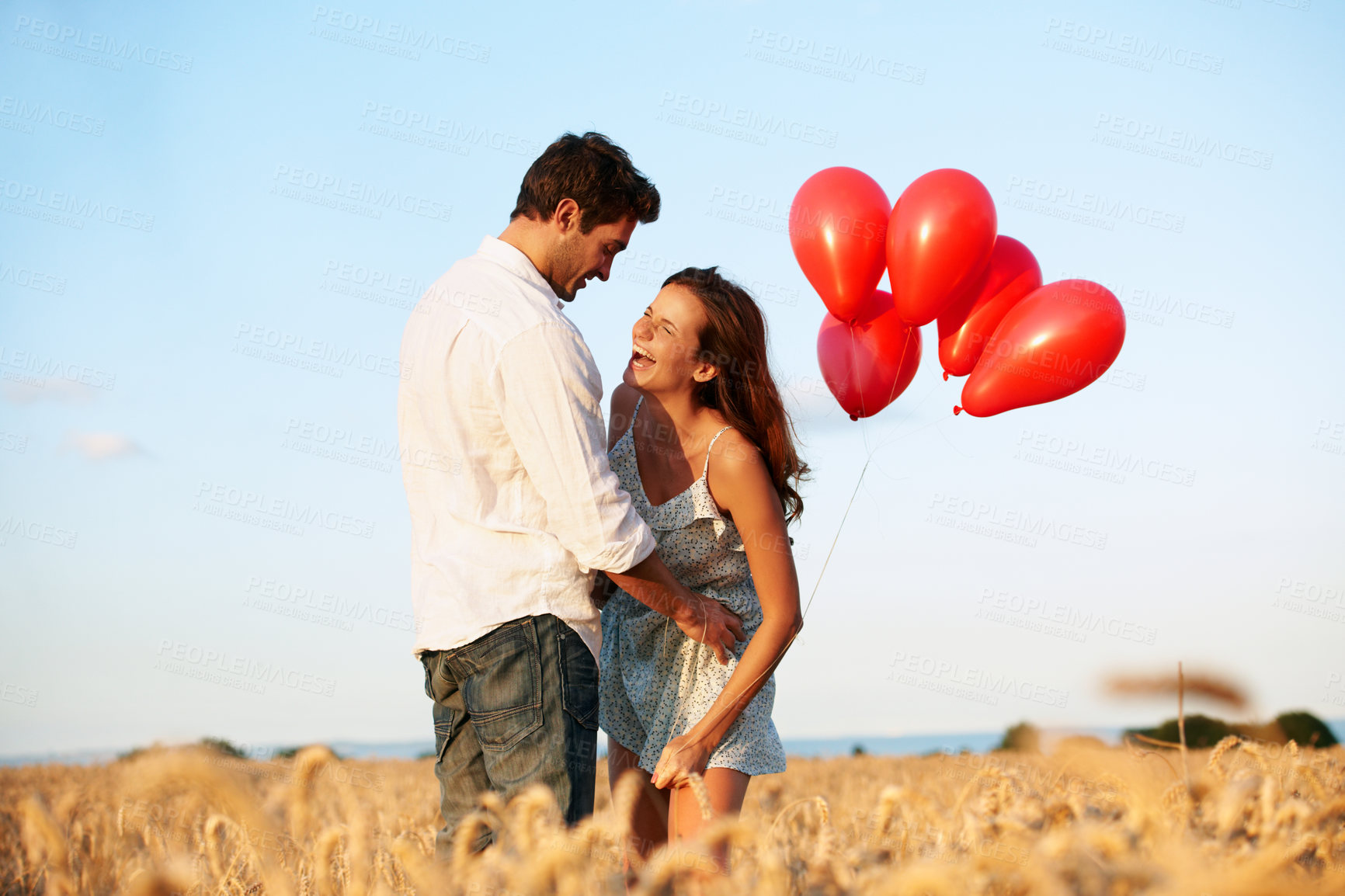 Buy stock photo Balloons, laugh and couple in nature with bonding, celebration or anniversary vacation. Happy, blue sky and man with woman outdoor with decoration on date for love in marriage on holiday together.