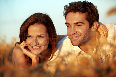 Buy stock photo Countryside, couple and relax in field with sunset, romantic getaway and bonding together for wellness. Happy, married people and outdoor with summer evening, relationship and love for connection.