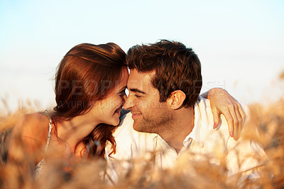 Buy stock photo Countryside, couple and relax in field with love, romantic getaway and bonding together for wellness. Happy, married people and outdoor with summer holiday, relationship and affection for connection.