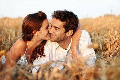Buy stock photo Countryside, couple and relax in field with smile, romantic getaway or bonding together for wellness. Happy, married people and outdoor with summer holiday, caring relationship or love for connection