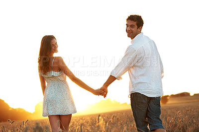 Buy stock photo Holding hands, sunset and portrait with couple in field for honeymoon getaway, support and trust. Care, connection and date with man and woman in countryside for loyalty, holiday and travel together