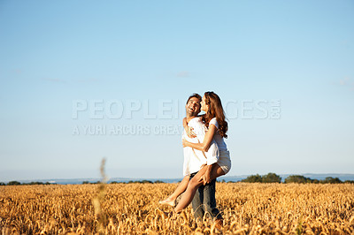 Buy stock photo Love, smile or couple in countryside with piggyback, romantic partner or bonding on summer break. Happy, space or people in nature with carrying, connection or playful relationship on outdoor date.