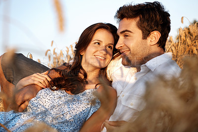 Buy stock photo Trust, happy couple and relax at wheat field, holiday or bonding together for healthy relationship. Break, woman or man rest at countryside farm with partner for love, smile or connection on vacation