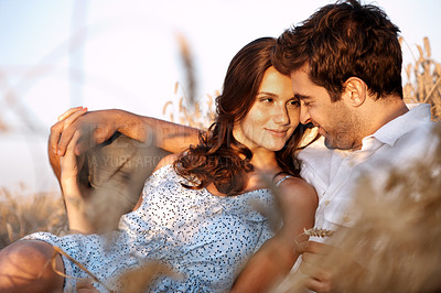 Buy stock photo Travel, couple and relax with bonding in wheat field for romantic trip, holiday connection or trust. Love, happy people and talking in countryside for anniversary getaway, peaceful date and affection