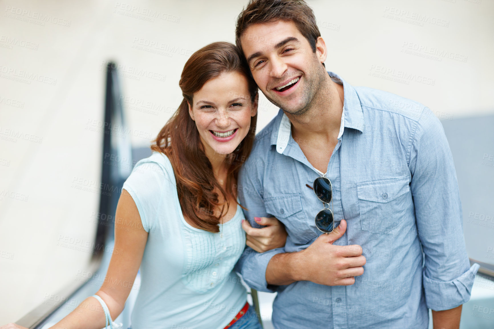 Buy stock photo Portrait, happy and couple on escalator in shopping mall for bonding, outing and weekend date. Laugh, relationship and man with woman on electric stairs for errands, retail therapy and trip together